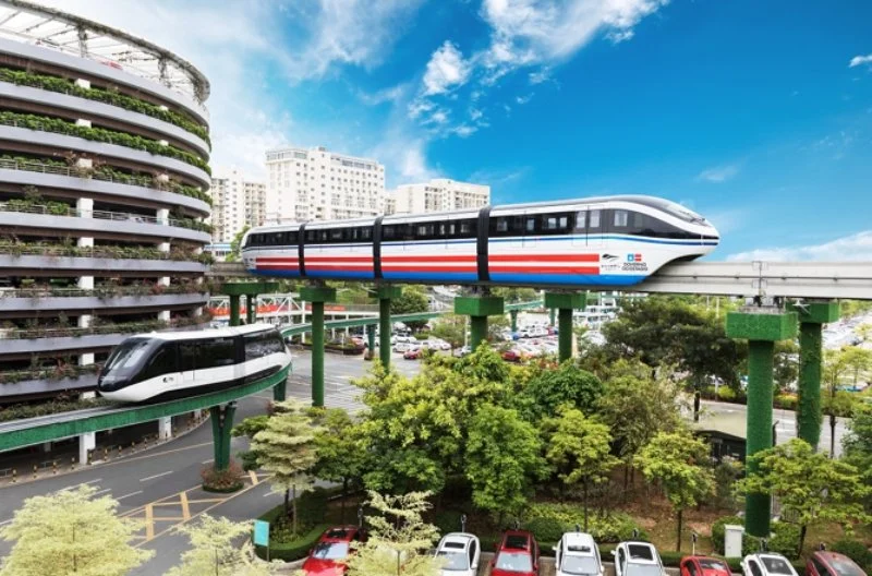 SkyRail with building in background going over trees